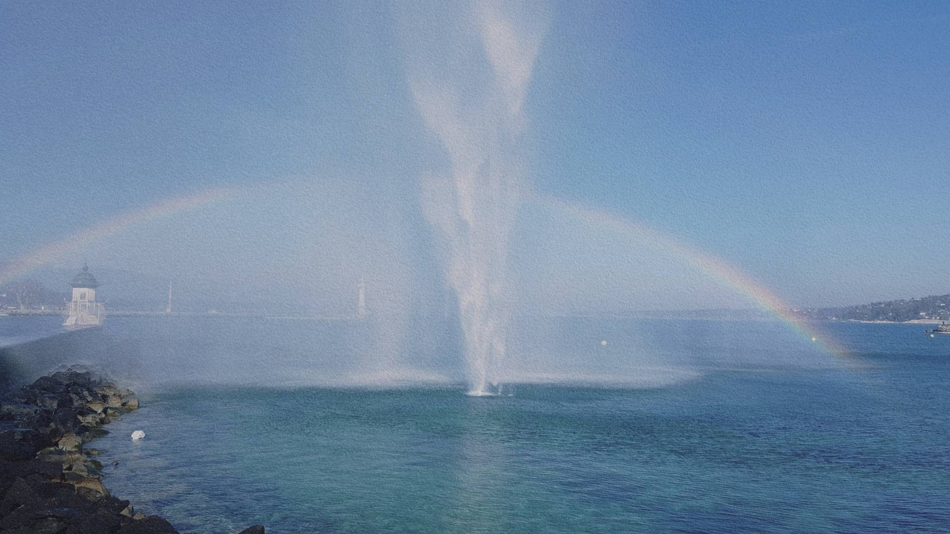 Jet d’eau de Genève sur le lac Léman avec arc-en-ciel formé par la projection