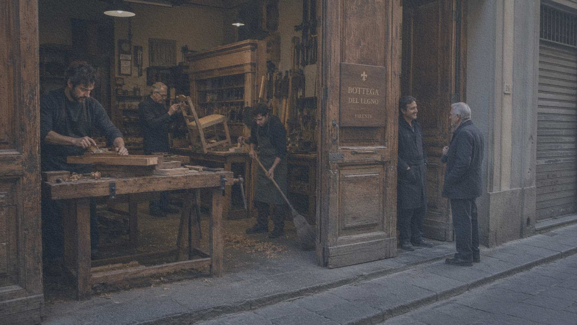 Une bottega italienne ouverte sur la rue, où plusieurs artisans travaillent tandis qu'un apprenti prépare l'atelier au début de la journée.