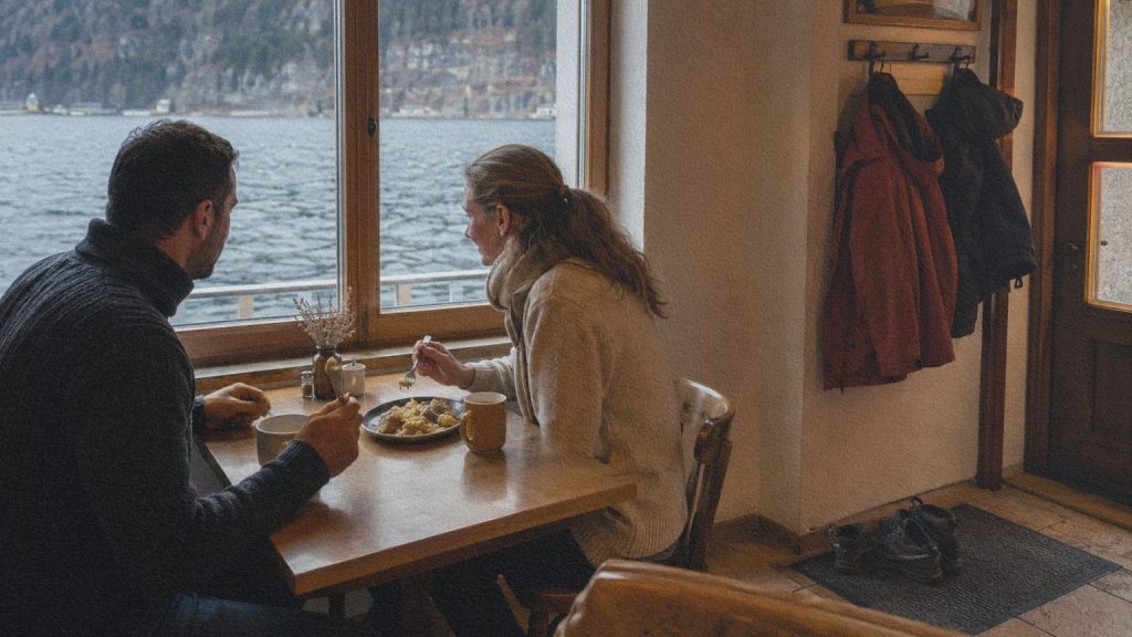Repas chaud servi dans une petite auberge de Hallstatt donnant sur le lac en hiver.